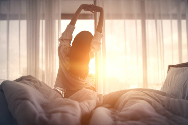 image of a woman waking up as Alexa routine